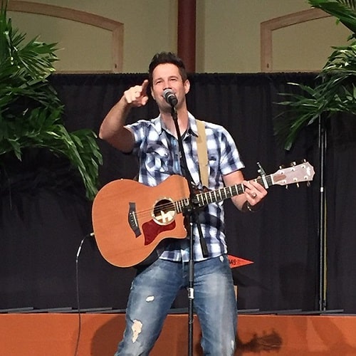 A picture of David Osmond performing live.